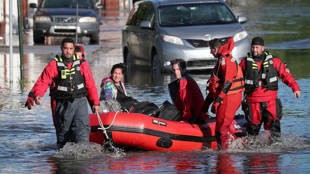 PHOTO: First responders pull local residents in a boat as they rescues people trapped by floodwaters after the remnants of Tropical Storm Ida affected parts of the northeast in Mamaroneck, New York, Sept. 2, 2021. 