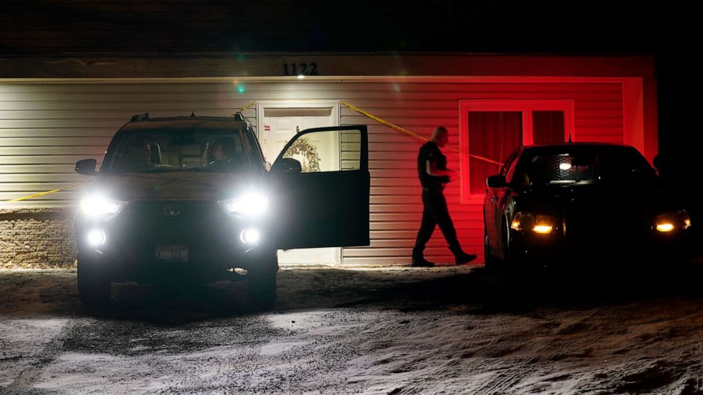 PHOTO: A private security officer, right, walks to his car after talking the occupants of another vehicle at left, Jan. 3, 2023, in front of the house in Moscow, Idaho where four University of Idaho students were killed in Nov. 2022.