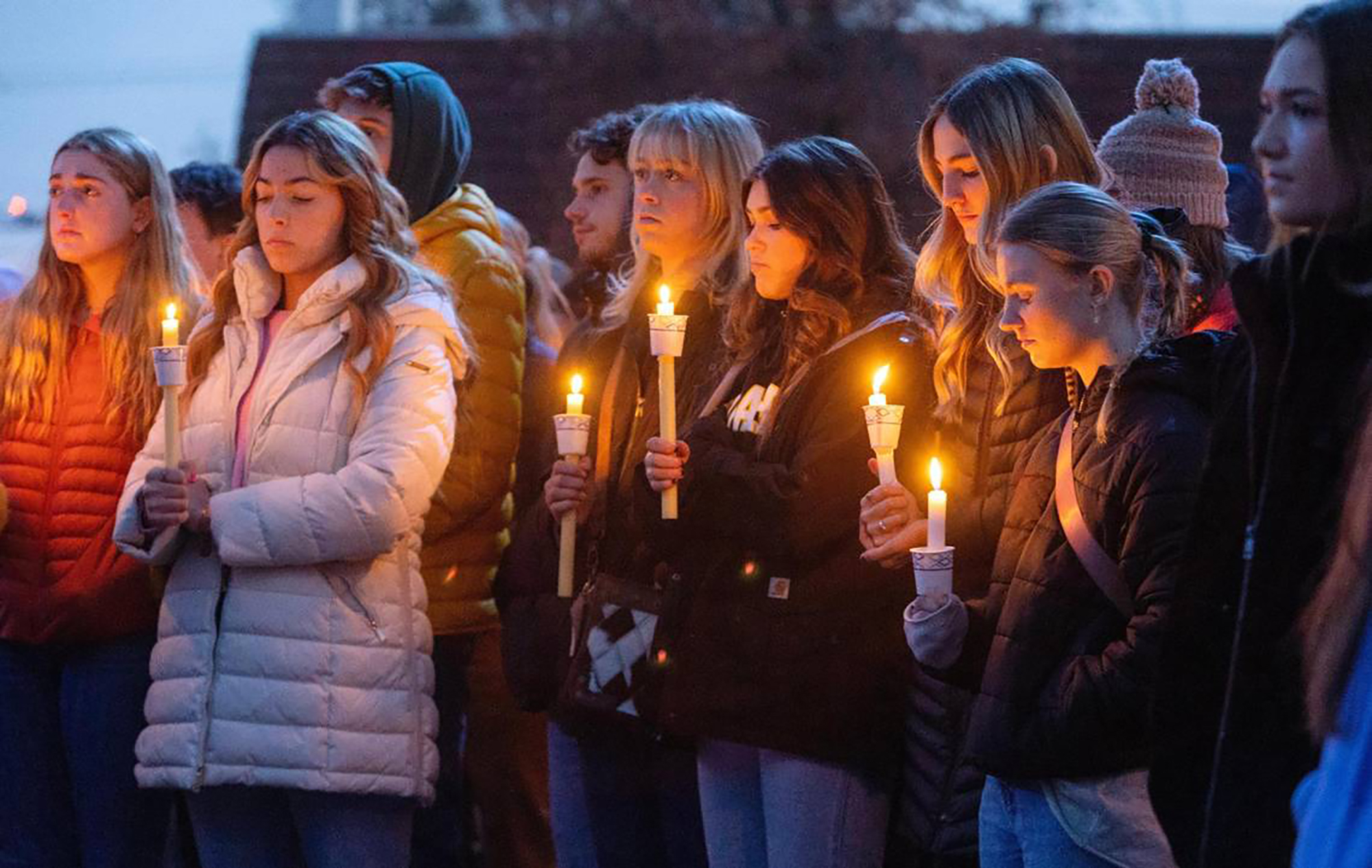 PHOTO: Boise State University students and people who knew the University of Idaho students who were killed in Moscow, Idaho, pay tribute at a vigil on Nov. 17, 2022, at BSU.