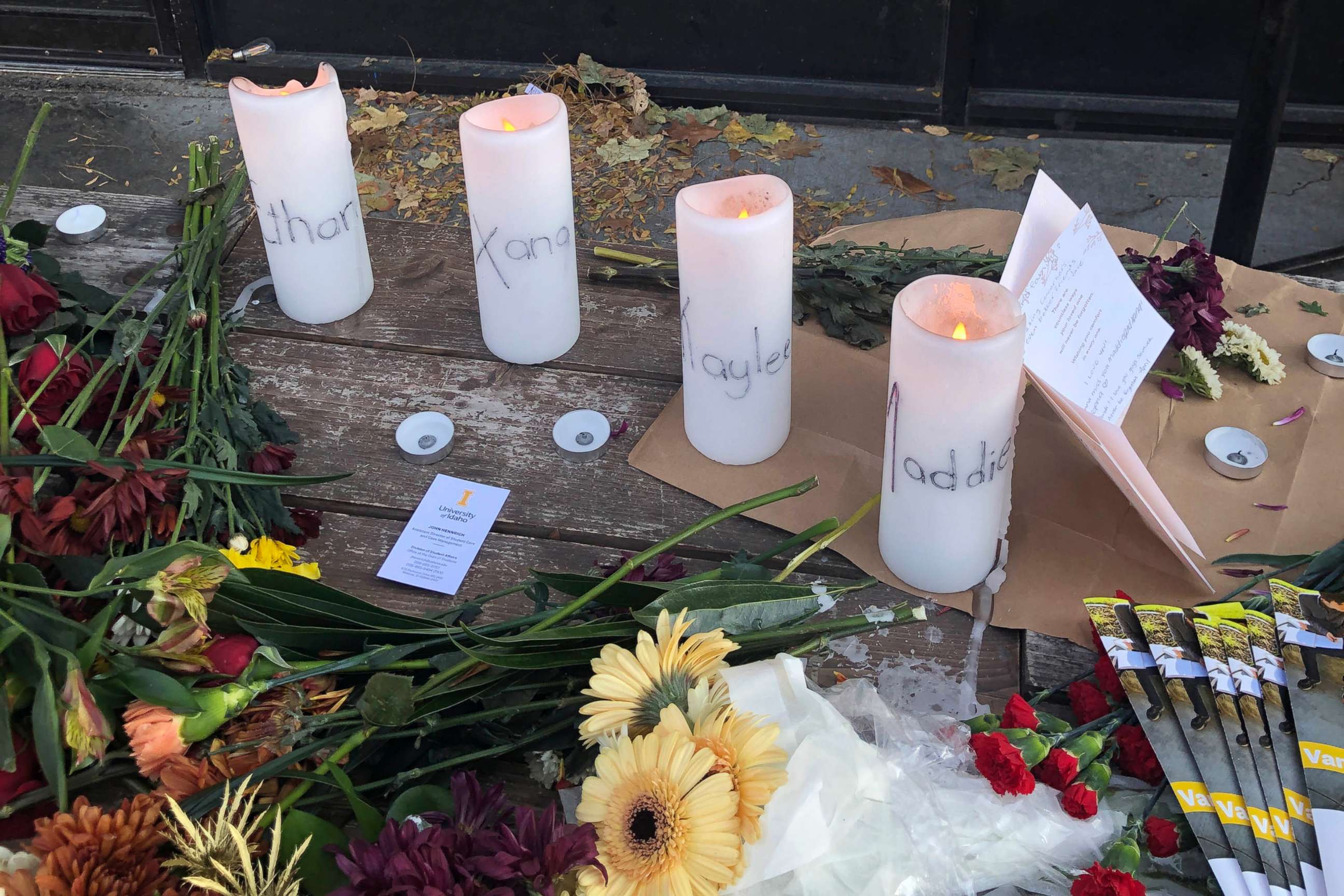 PHOTO: Candles and flowers are left at a make-shift memorial honoring four slain University of Idaho students outside the Mad Greek restaurant in downtown Moscow, Idaho, on Tuesday, Nov. 15, 2022.