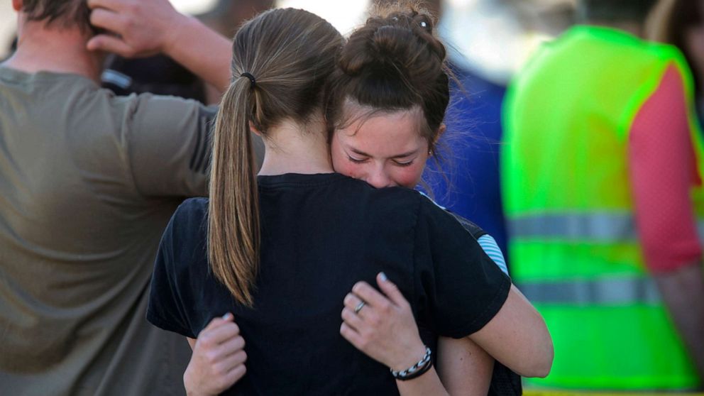 PHOTO: Students embrace after a school shooting at Rigby Middle School in Rigby, Idaho on Thursday, May 6, 2021.