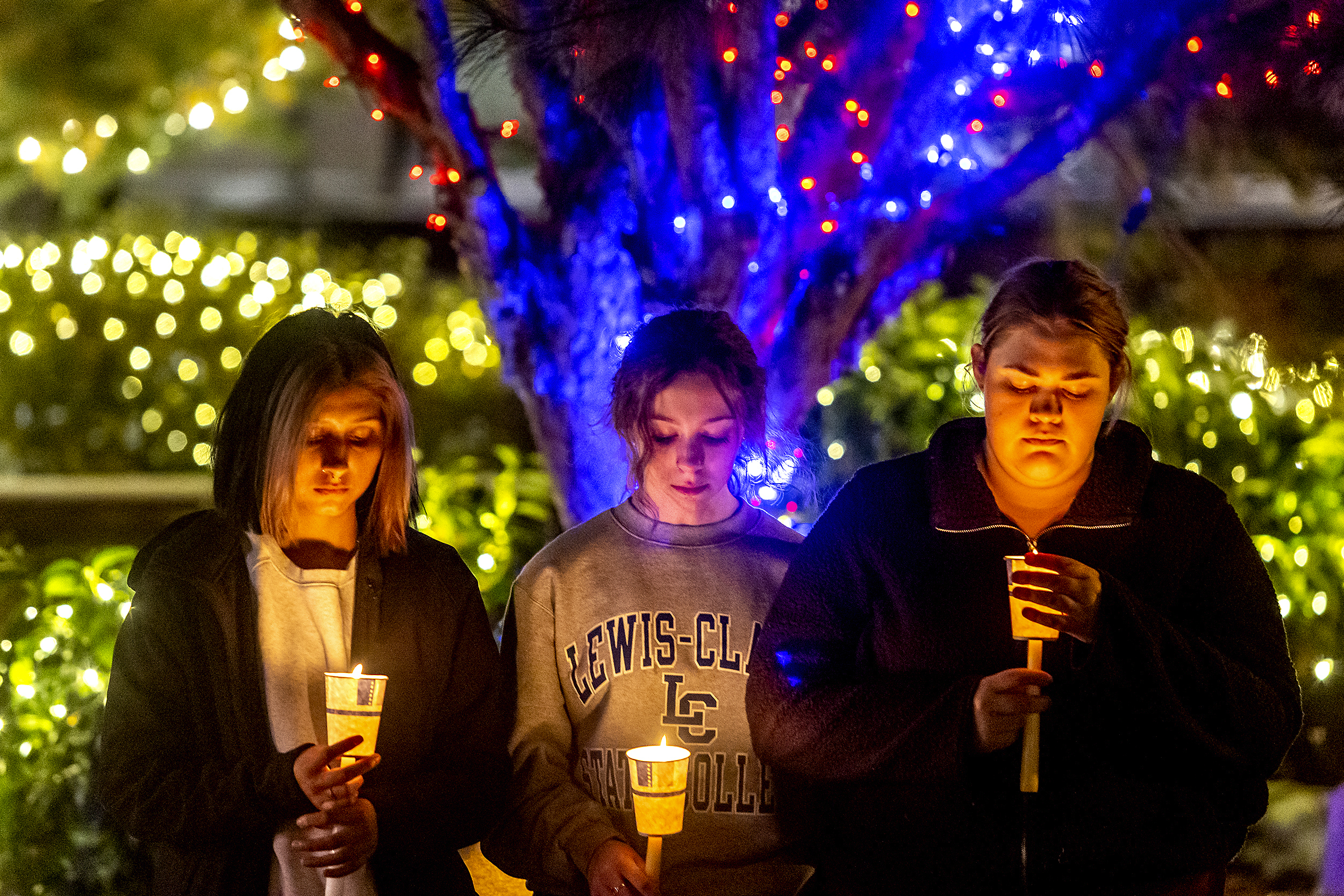 PHOTO: Lewis-Clark State College students pay their respects for the four University of Idaho students who where killed in Moscow, Idaho, at a vigil held at their campus in Lewiston, Idaho, Nov. 30, 2022. 