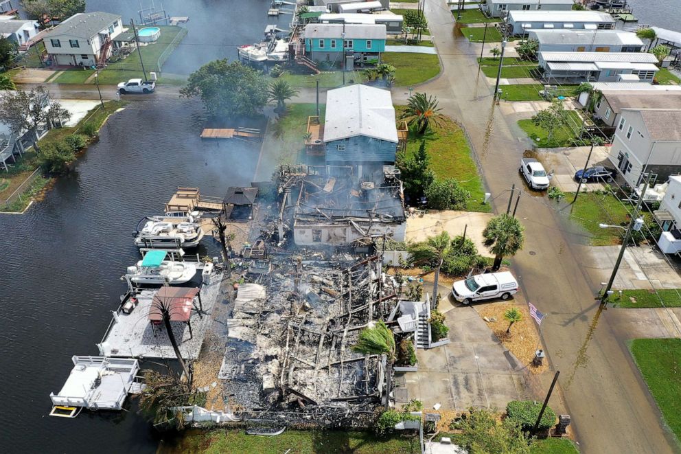 PHOTO: A home smolders after burning as Hurricane Idalia passed offshore, Aug. 30, 2023 in Hudson, Fla.