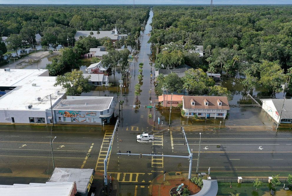 PHOTO: A vehicle drives through a flooded street in the downtown area after Hurricane Idalia passed offshore on Aug. 30, 2023, in Crystal River, Fla. Hurricane Idalia hit the Big Bend area on the Gulf Coast of Florida as a Category 3 storm.