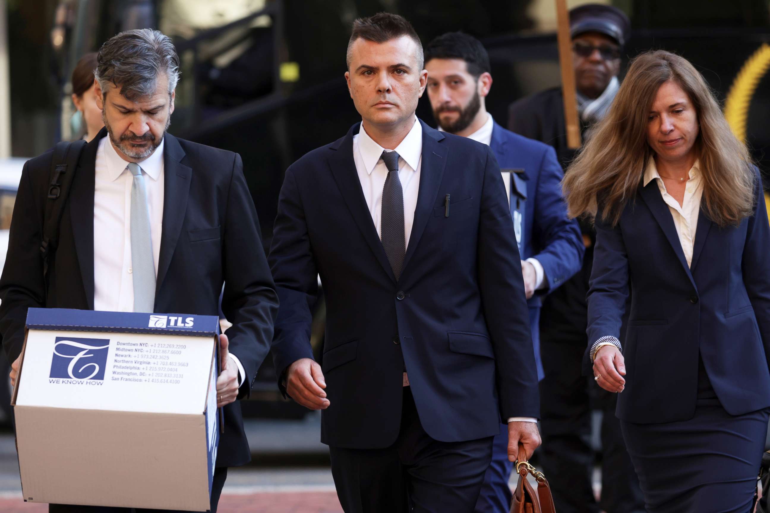 PHOTO: Russian analyst Igor Danchenko, center, arrives at the Albert V. Bryan U.S. Courthouse for his trial on Oct. 11, 2022 in Alexandria, Virginia. 