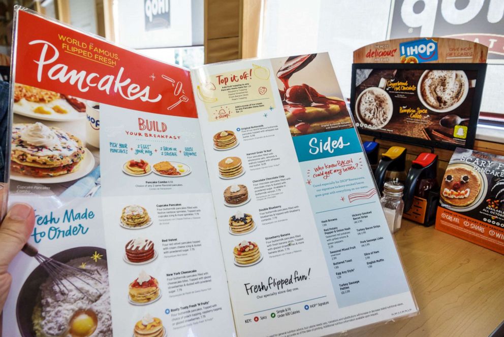 PHOTO: A patron holds a menu at an International House of Pancakes in Gainseville, Fla., Oct. 27, 2017.