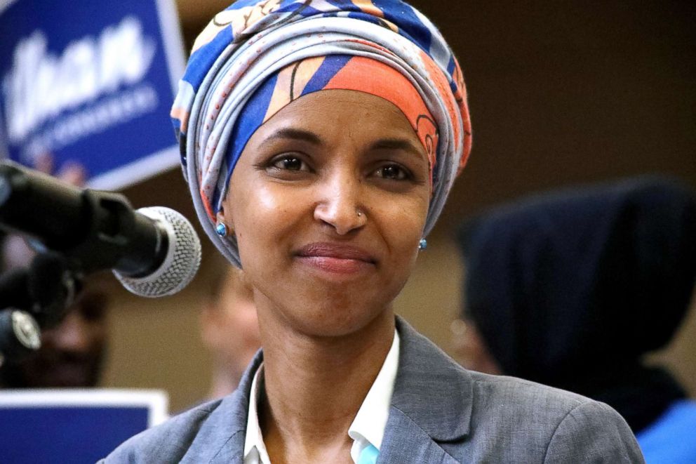 Minnesota Representative Ilhan Omar smiles while speaking during the Democratic Farmer Labor (DFL) Party endorsement convention in Minneapolis, June 17, 2018.