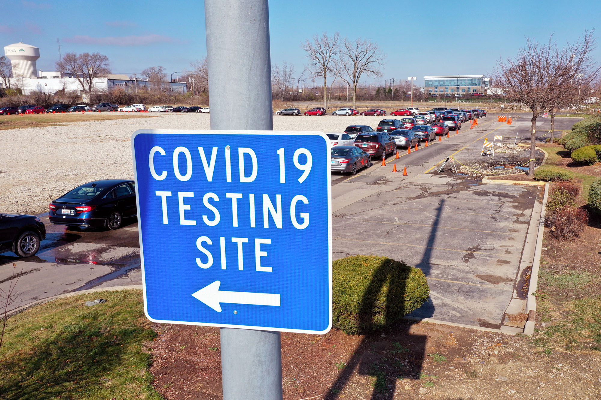 PHOTO: Residents in cars wait in line at a drive-up COVID-19 test site in Aurora, Ill., Nov. 13, 2020.