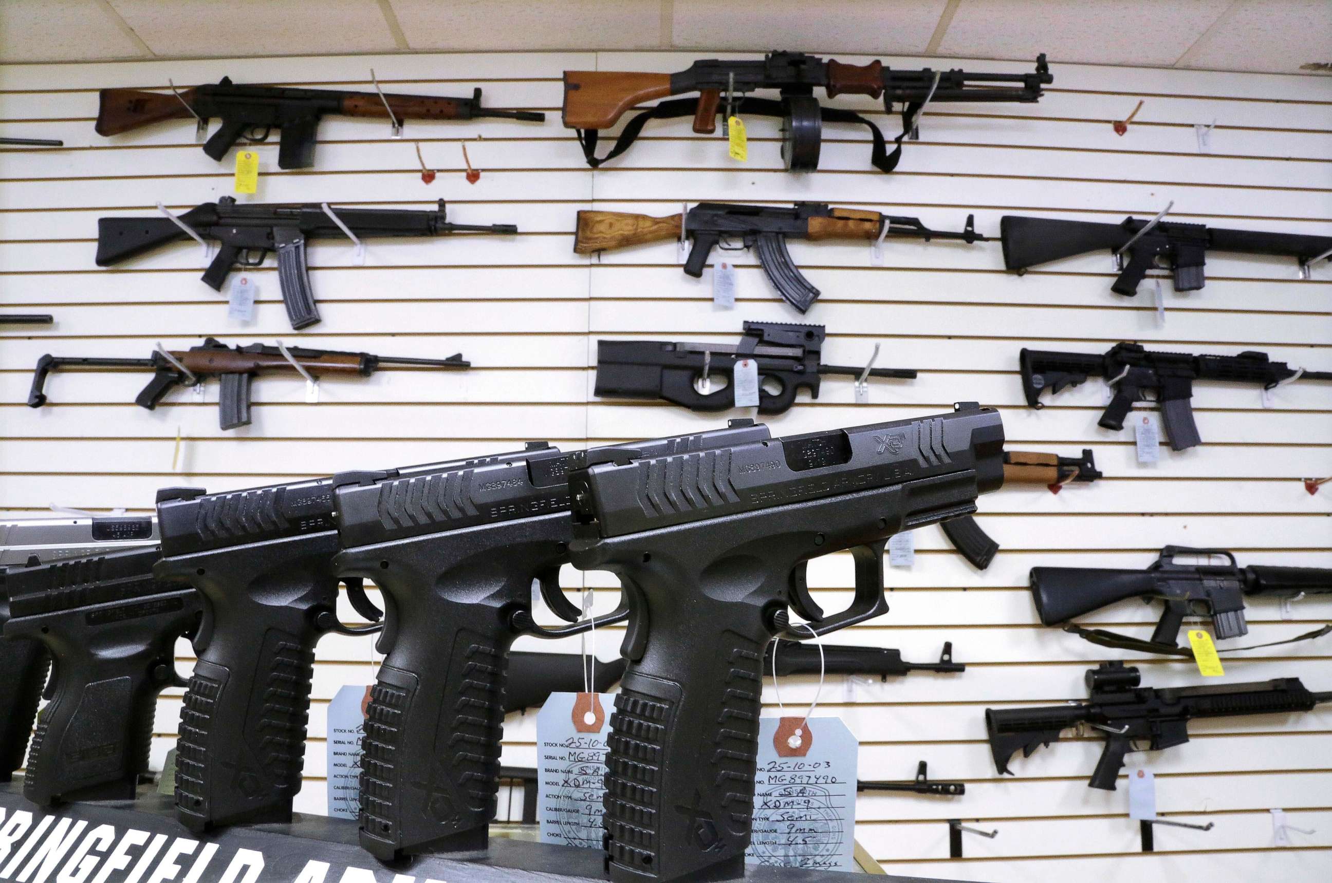 PHOTO: Assault weapons and hand guns are seen for sale at Capitol City Arms Supply on Jan. 16, 2013, in Springfield, Ill.