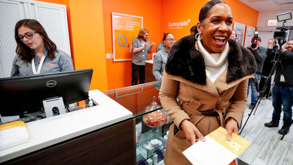 PHOTO: Lieutenant Governor of Illinois Juliana Stratton smiles after making a purchase at Sunnyside Cannabis Dispensary on Jan. 1, 2020, in Chicago.