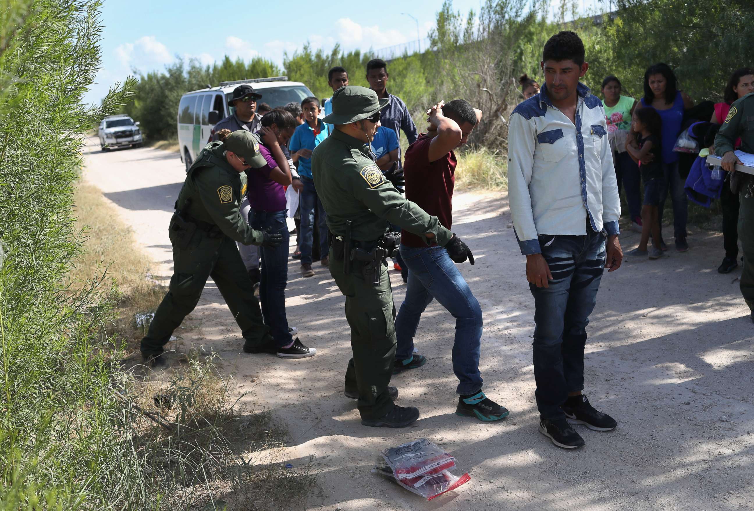 PHOTO: Border Patrol agents take a group of Central American asylum seekers into custody on June 12, 2018, near McAllen, Texas.