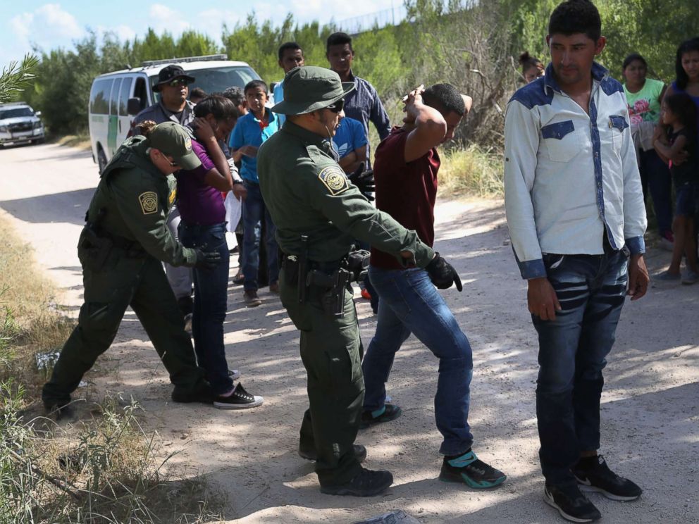 PHOTO: Border Patrol agents take a group of Central American asylum seekers into custody on June 12, 2018, near McAllen, Texas.