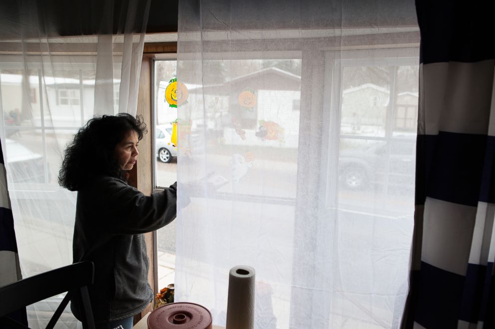 PHOTO: Antonia looks out of the window at her new home in New Brighton, Minn.