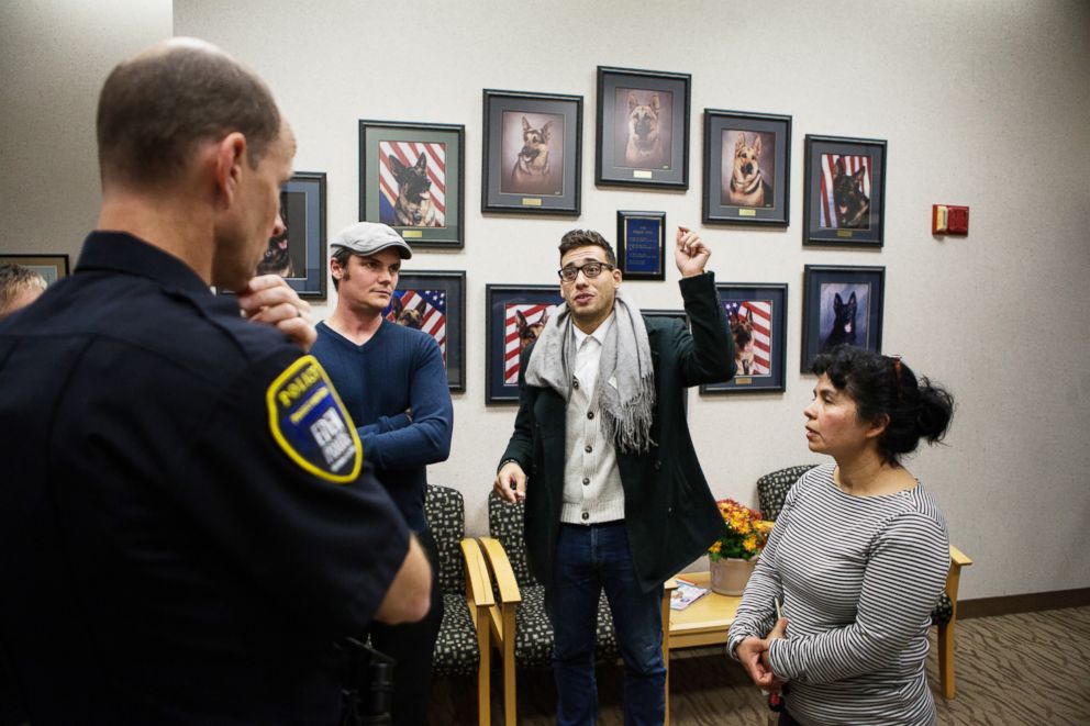 PHOTO: Alvarez and other members of her organization inform police that Asamblea will attempt a sit-in protest at Congressman Erik Paulsen's office.
