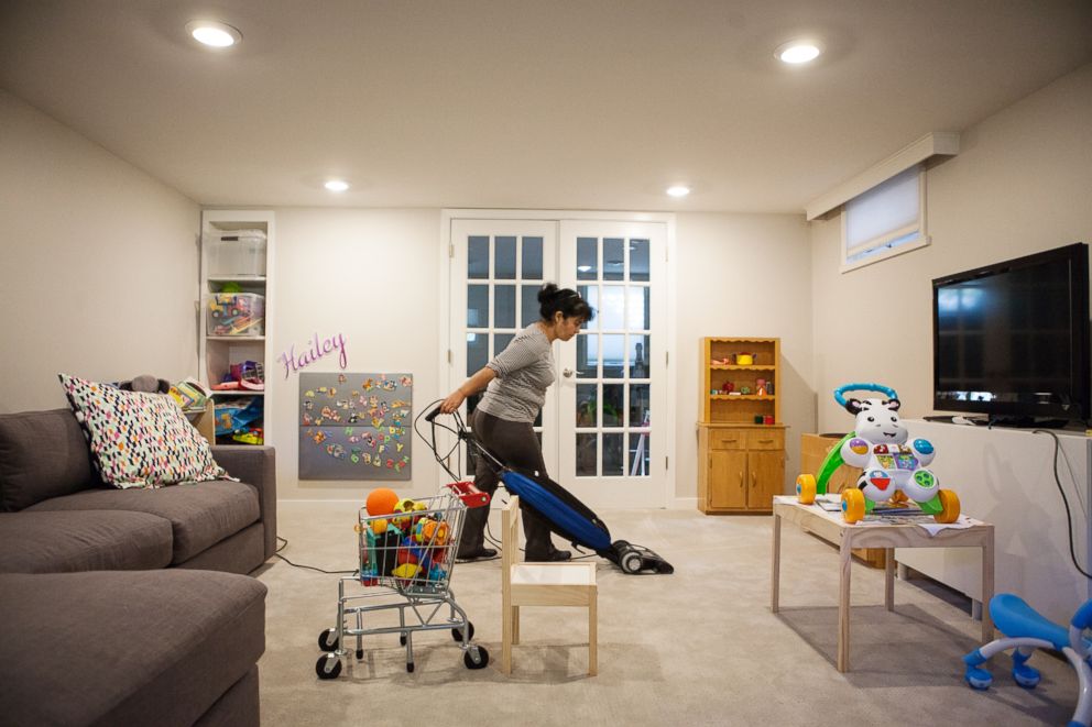 PHOTO: Alvarez cleans a clients home. 
