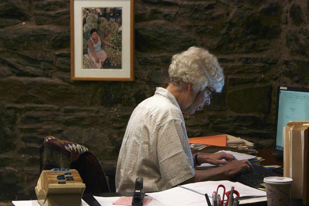 PHOTO: Anne Pilsbury, Executive Director at Central American Legal Assistance in Brooklyn, New York, works at her desk.