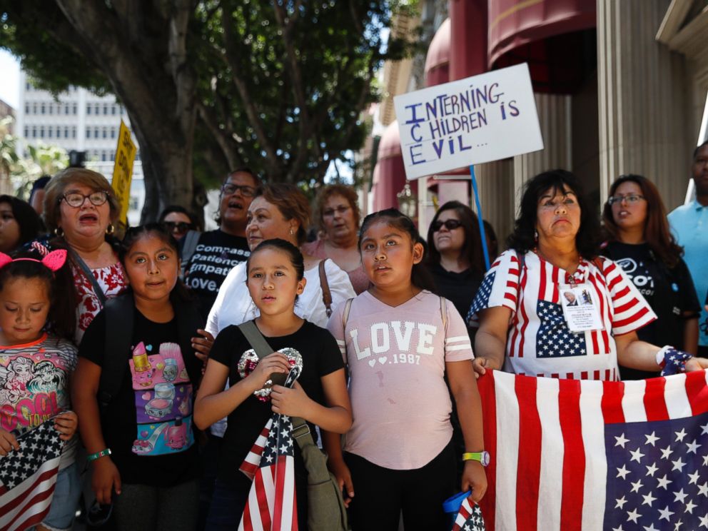 People gather outside the Millennium Biltmore Hotel to protest against U.S. Attorney General Jeff Sessions, Tuesday, June 26, 2018, in Los Angeles. Sessions gave a speech at the hotel.