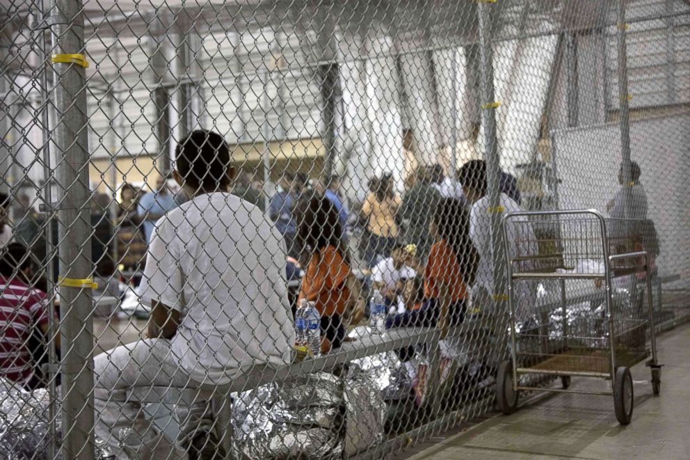 PHOTO: This US Customs and Border Protection photo obtained June 18, 2018 shows intake of illegal border crossers by US Border Patrol agents at the Central Processing Center in McAllen, Texas, May 23, 2018.