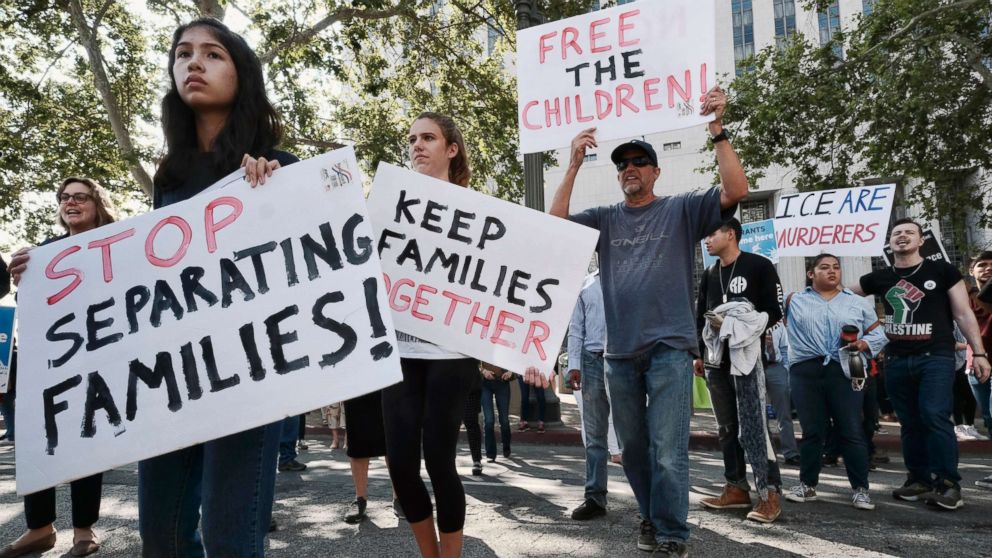 PHOTO: Protesters carry signs and chant slogans in front of Federal Courthouse in Los Angeles, June 26, 2018.