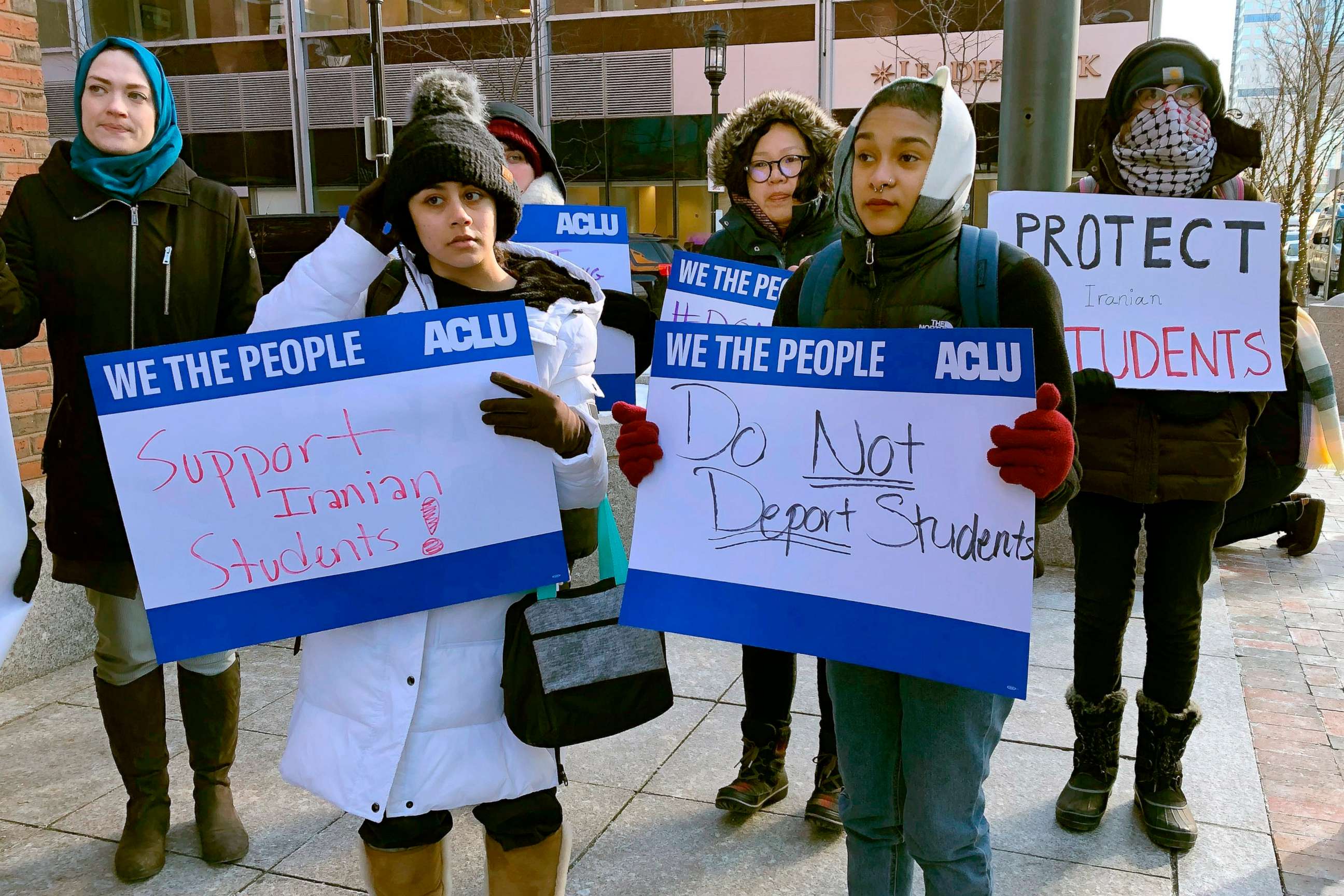 PHOTO: Protesters stand outside the federal courthouse where a hearing was scheduled for Northeastern University student Shahab Dehghani, Jan. 21, 2020, in Boston.