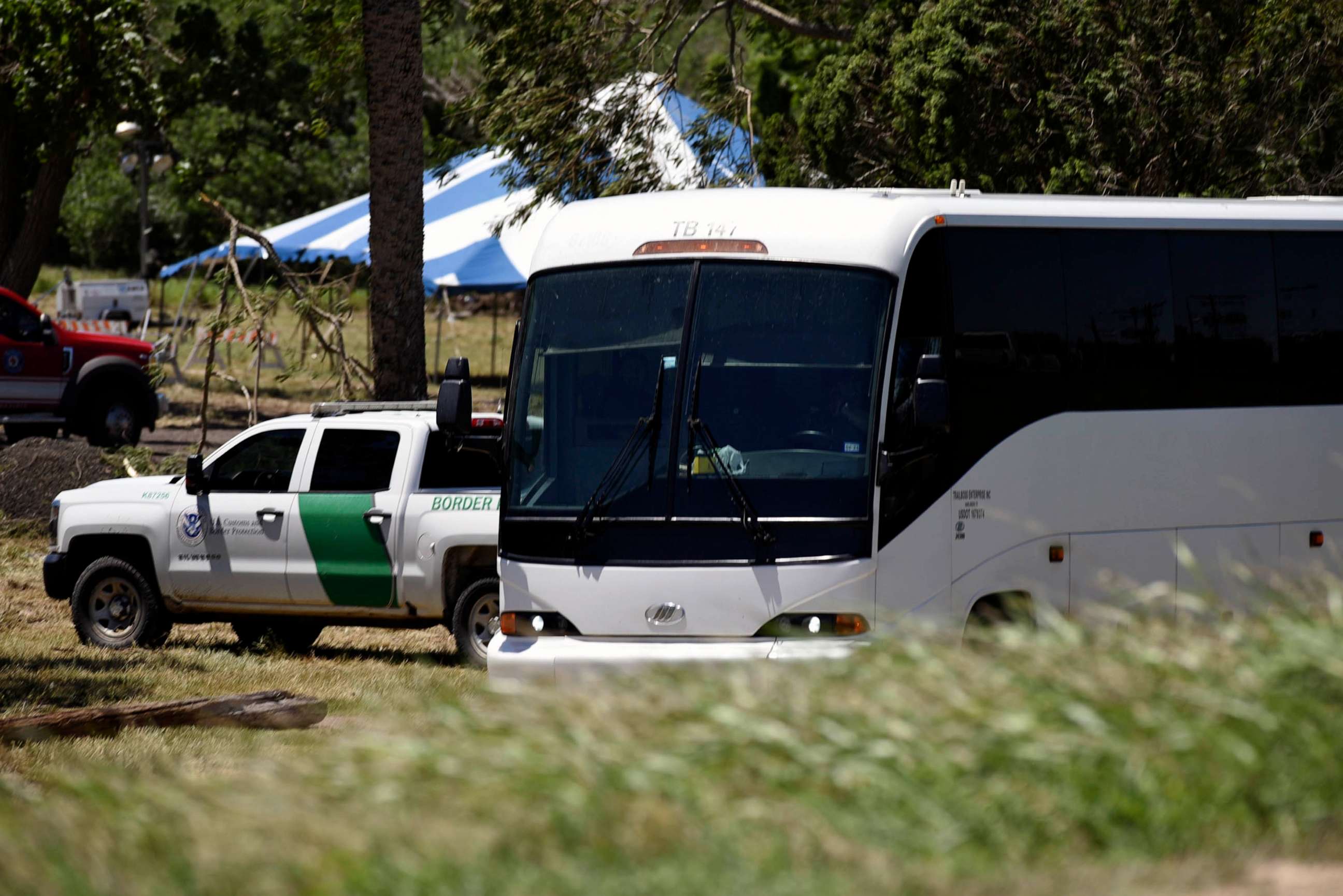 PHOTO: FILE - A Border Patrol vehicle and bus are parked near a staging area near the U.S.-Mexico border in Brownsville, Texas, April 29, 2023.
