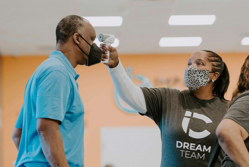 PHOTO: In this photo provided by Impact Church, a man gets his temperature taken during a vaccination event held by Impact Church on Aug. 8, 2021, in Jacksonville, Fla.