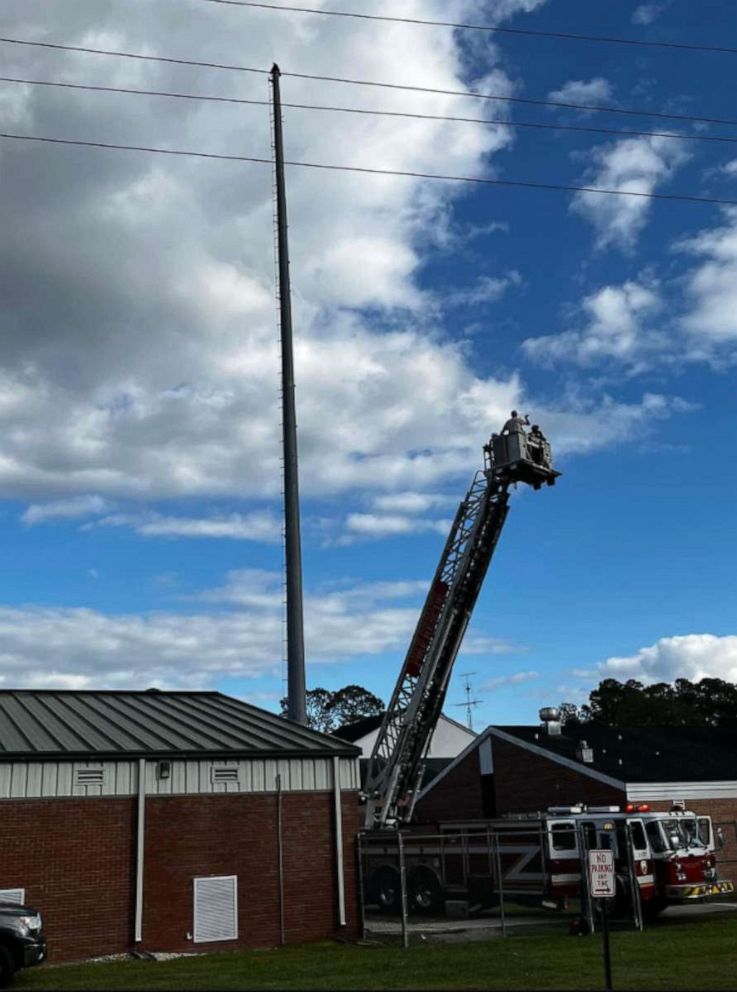 PHOTO: In this photo posted to the Macclenny Fire and Rescue Service FaceBook account, the impaled eagle is shown being rescued.