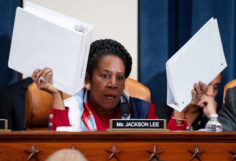 PHOTO: Rep. Sheila Jackson Lee holds up copies of the Mueller Report as she questions constitutional scholars during a House Judiciary Committee hearing on Capitol Hill in Washington, Dec. 4, 2019.