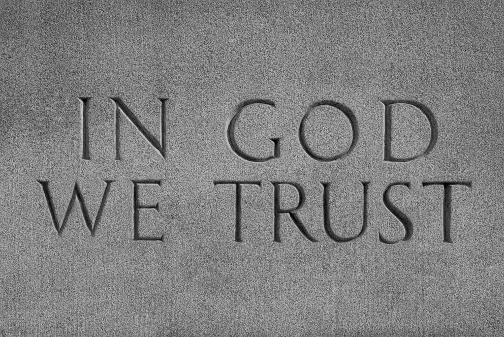 PHOTO: In this undated file photo, the saying "In God We Trust" is shown inscribed on a wall.