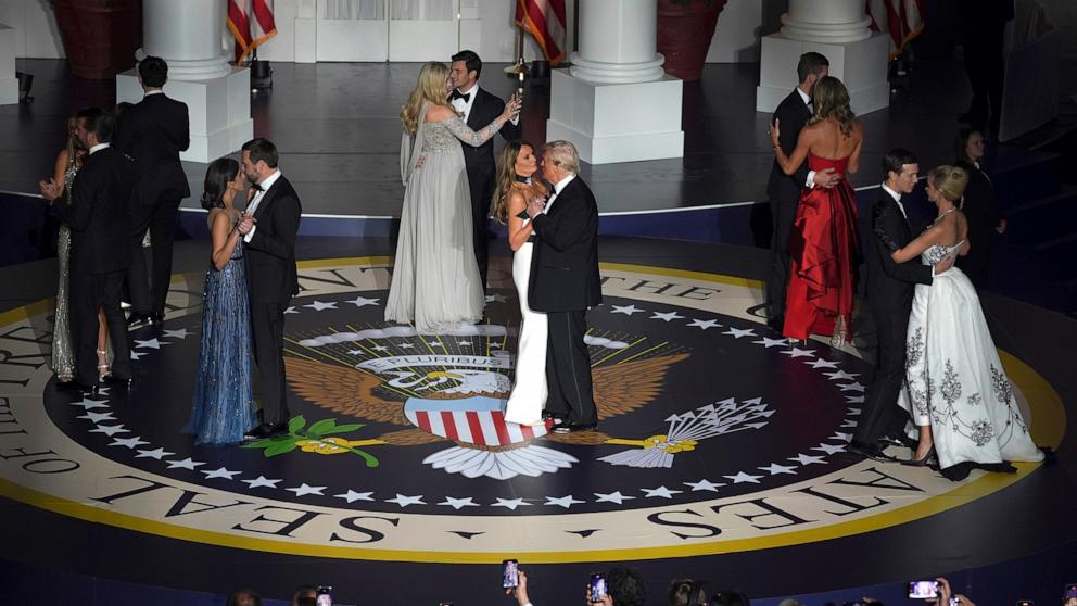 PHOTO: President Donald Trump and first lady Melania Trump, Vice President JD Vance and second lady Usha Vance, dance with other family members at the Starlight Ball, part of the 60th Presidential Inauguration, Jan. 21, 2025, in Washington.