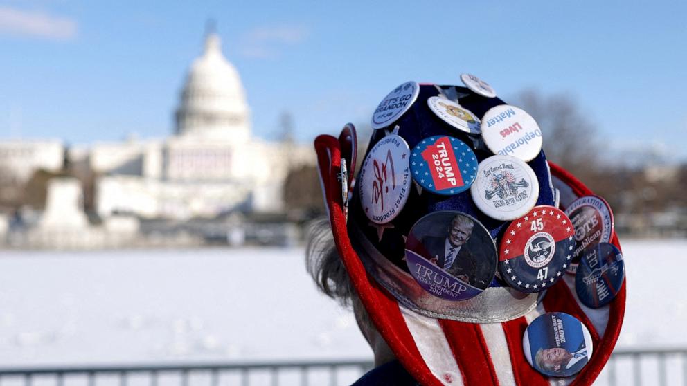 PHOTO: A woman wears a hat with badges supporting Donald Trump near the U.S. Capitol in Washington, Jan. 17, 2025. 