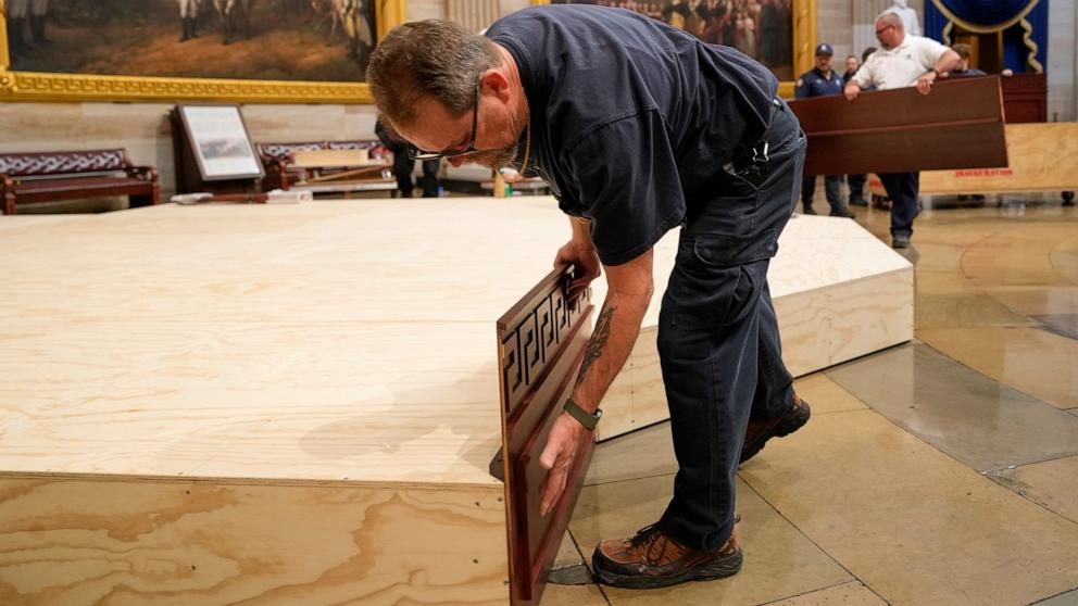 PHOTO: Workers build a stage in the U.S. Capitol Rotunda in Washington, Jan. 17, 2025, for the 60th Presidential Inauguration which was moved indoors because of cold temperatures.