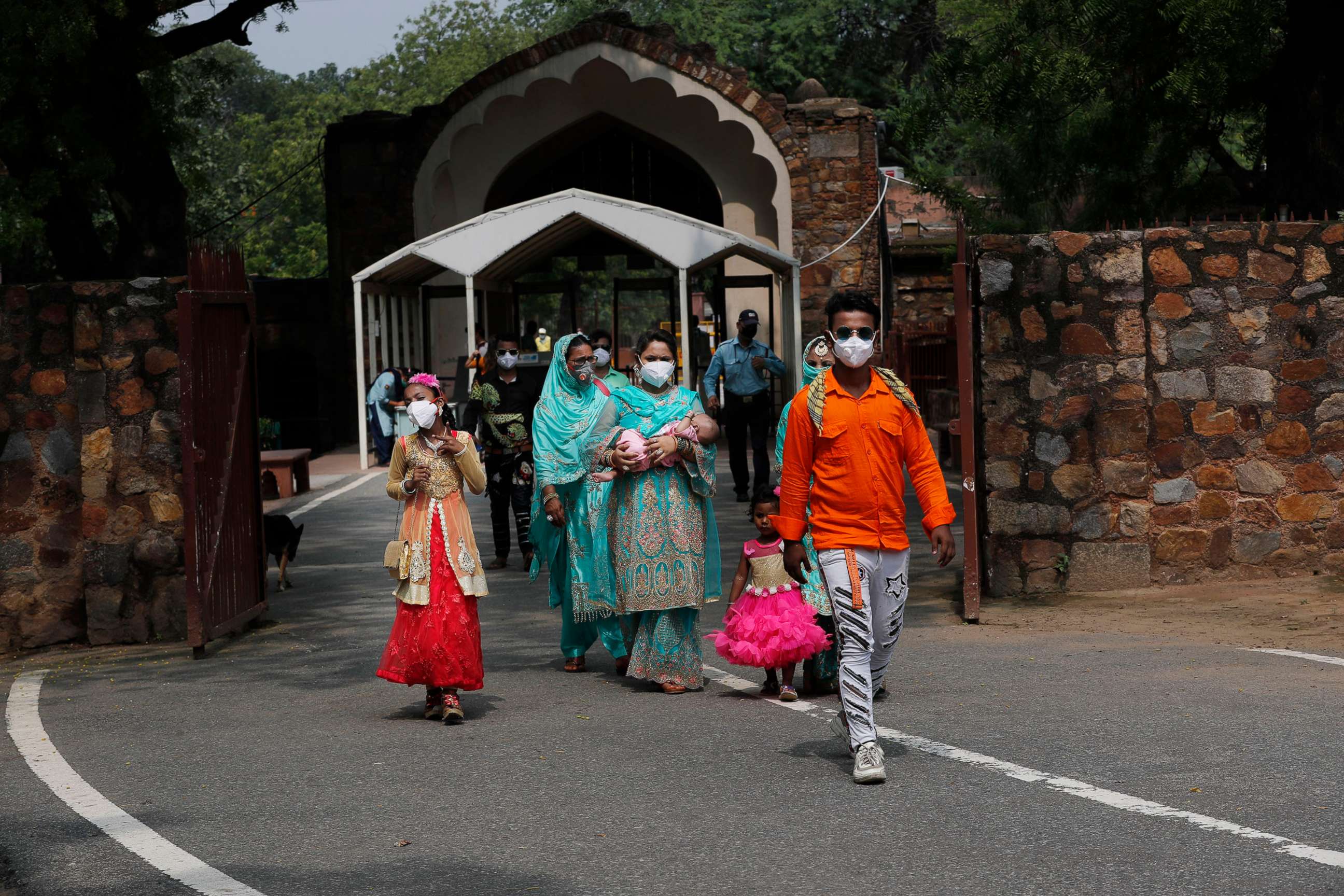 PHOTO: A family visits the Qutab Minar monument after monuments across India were reopened after almost four moths of lockdown to control the spread of coronavirus, in New Delhi, India, July 6, 2020.