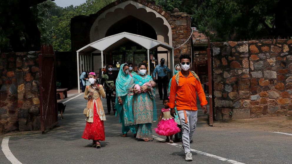 PHOTO: A family visits the Qutab Minar monument after monuments across India were reopened after almost four moths of lockdown to control the spread of coronavirus, in New Delhi, India, July 6, 2020.