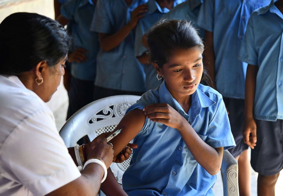 PHOTO: An health worker injects a measles and rubella (MR) vaccine into a student's arm at a government school at Hatibhangi village in Morigoan in Assam state on Sept. 4, 2018.