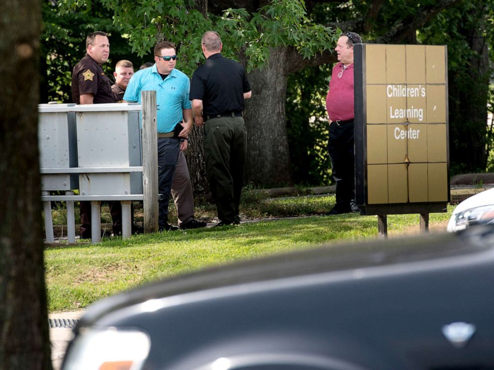 PHOTO: Members of the Vanderburgh County Sheriffs Office investigate the death of a child left in a hot car at the University of Southern Indianas Childrens Learning Center, July 9, 2019.