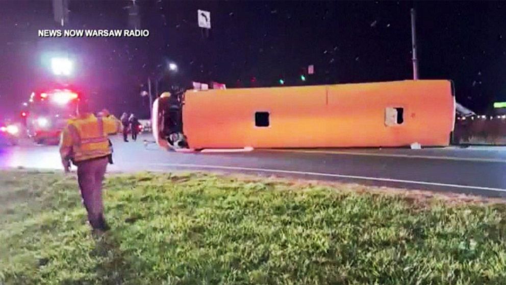 PHOTO: First responders investigate the scene of a overturned school bus in Warsaw, Ind., Nov. 12, 2022.