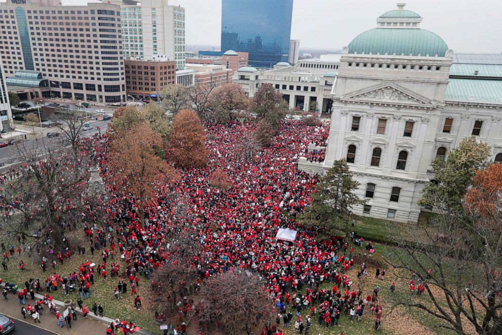 PHOTO: Thousands of Indiana teachers wearing red surround the Statehouse in Indianapolis, Nov. 19, 2019, for a rally calling for further increasing teacher pay amid a wave of educator activism across the country.