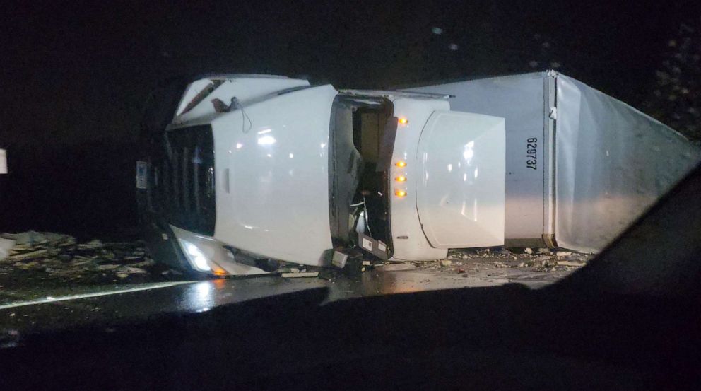 PHOTO: An overturned truck is seen on the road following a tornado in Whiteland, Indiana, on April 1, 2023, in this screen grab obtained from a social media video.