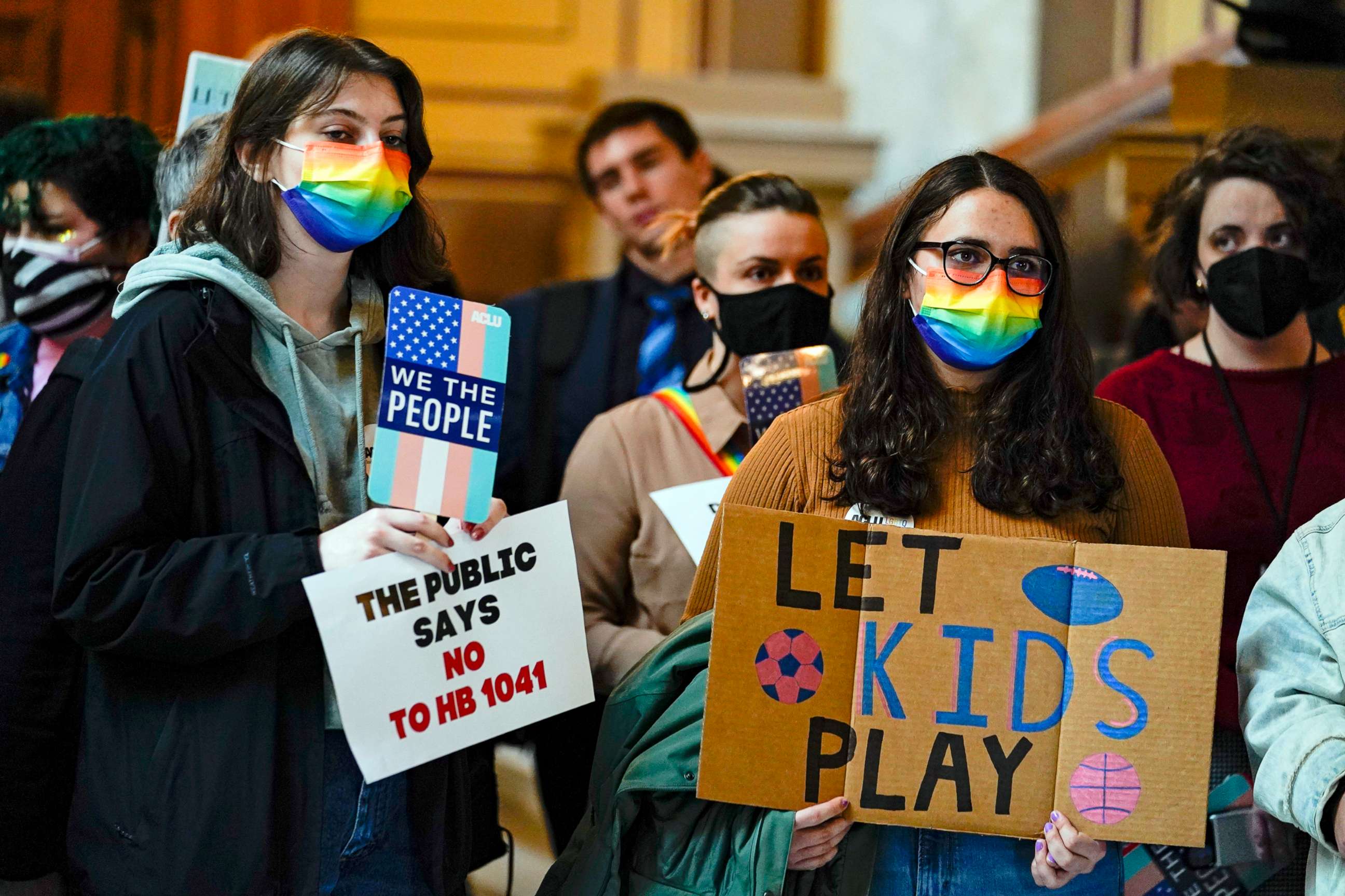 PHOTO: People gather to protest against HB1041, a bill to ban transgender women and girls from participating in school sports that match their gender identity, during a rally at the Statehouse in Indianapolis, Wednesday, Feb. 9, 2022.