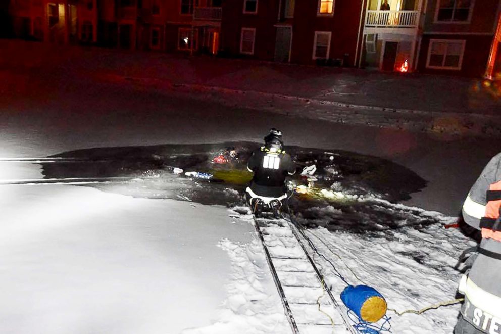 PHOTO:Fire crews raced to rescue a woman from her submerged car after she drove into an icy pond at an apartment complex in Indianapolis.