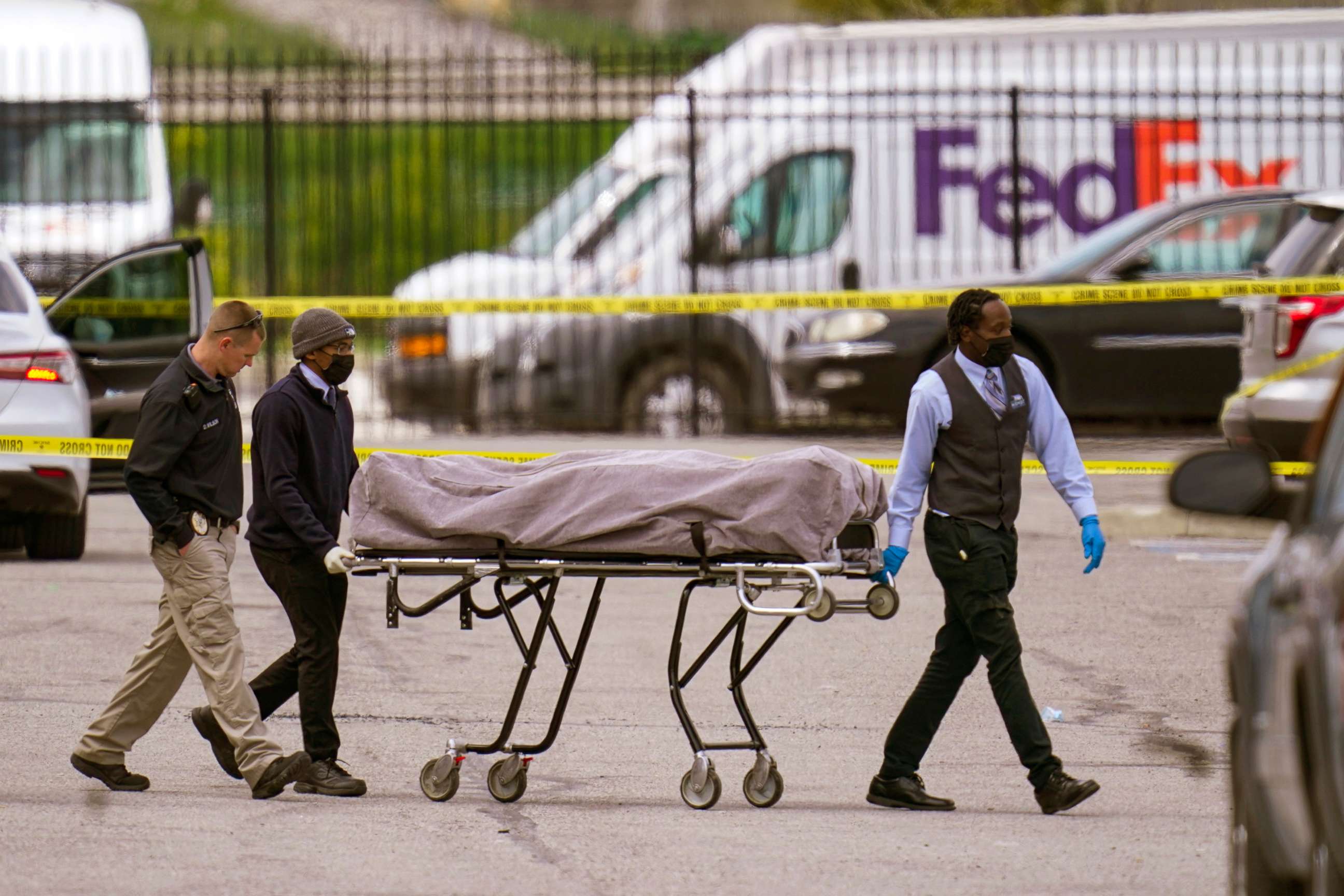 PHOTO: A body is taken from the scene where multiple people were shot at a FedEx Ground facility in Indianapolis, April 16, 2021.