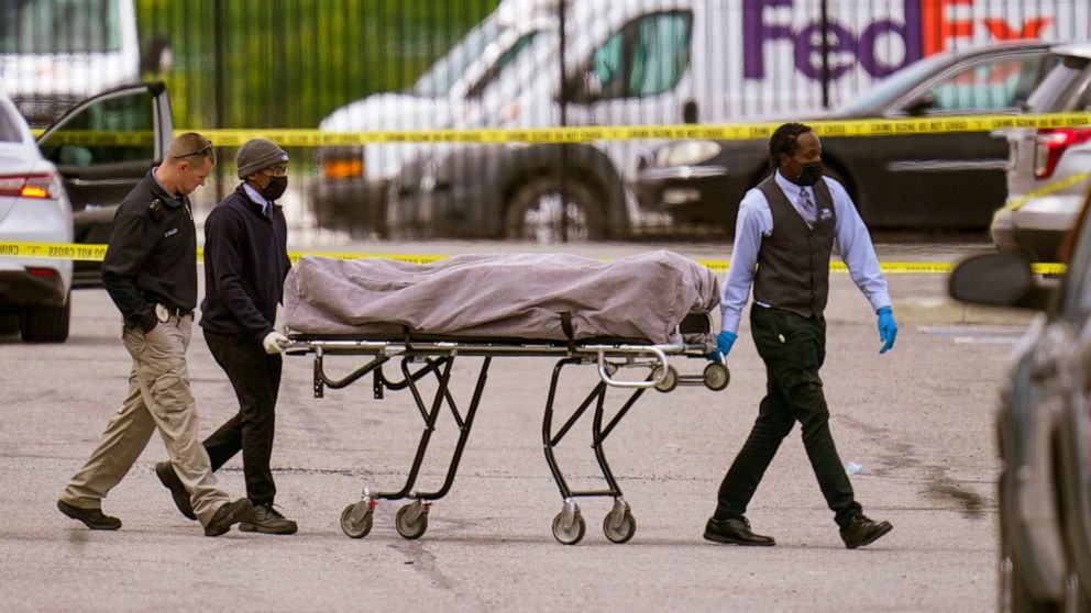 PHOTO: A body is taken from the scene where multiple people were shot at a FedEx Ground facility in Indianapolis, April 16, 2021.