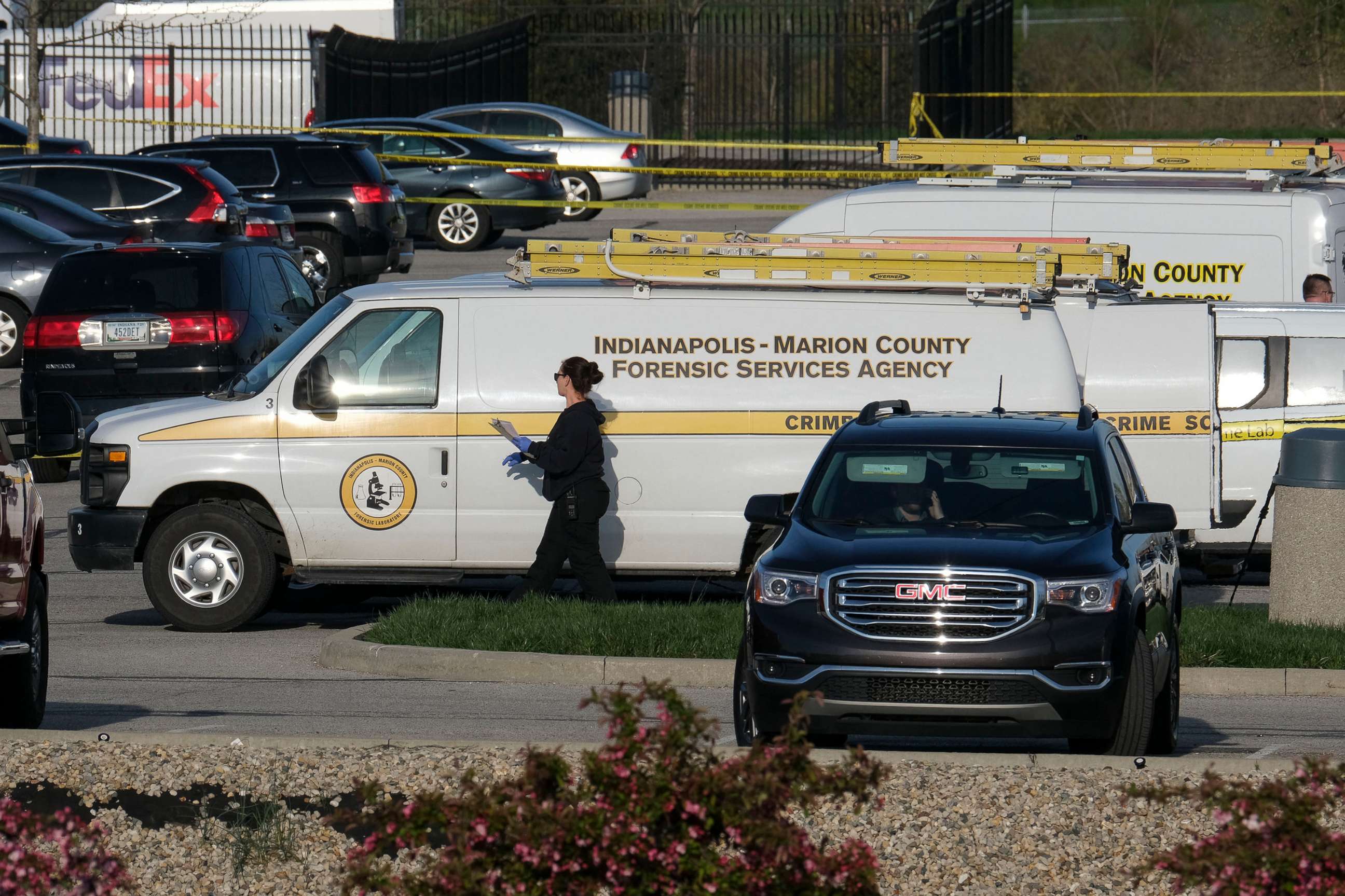 PHOTO: Marion County Forensic Services vehicles are parked at a FedEx facility in Indianapolis, April 16, 2021.