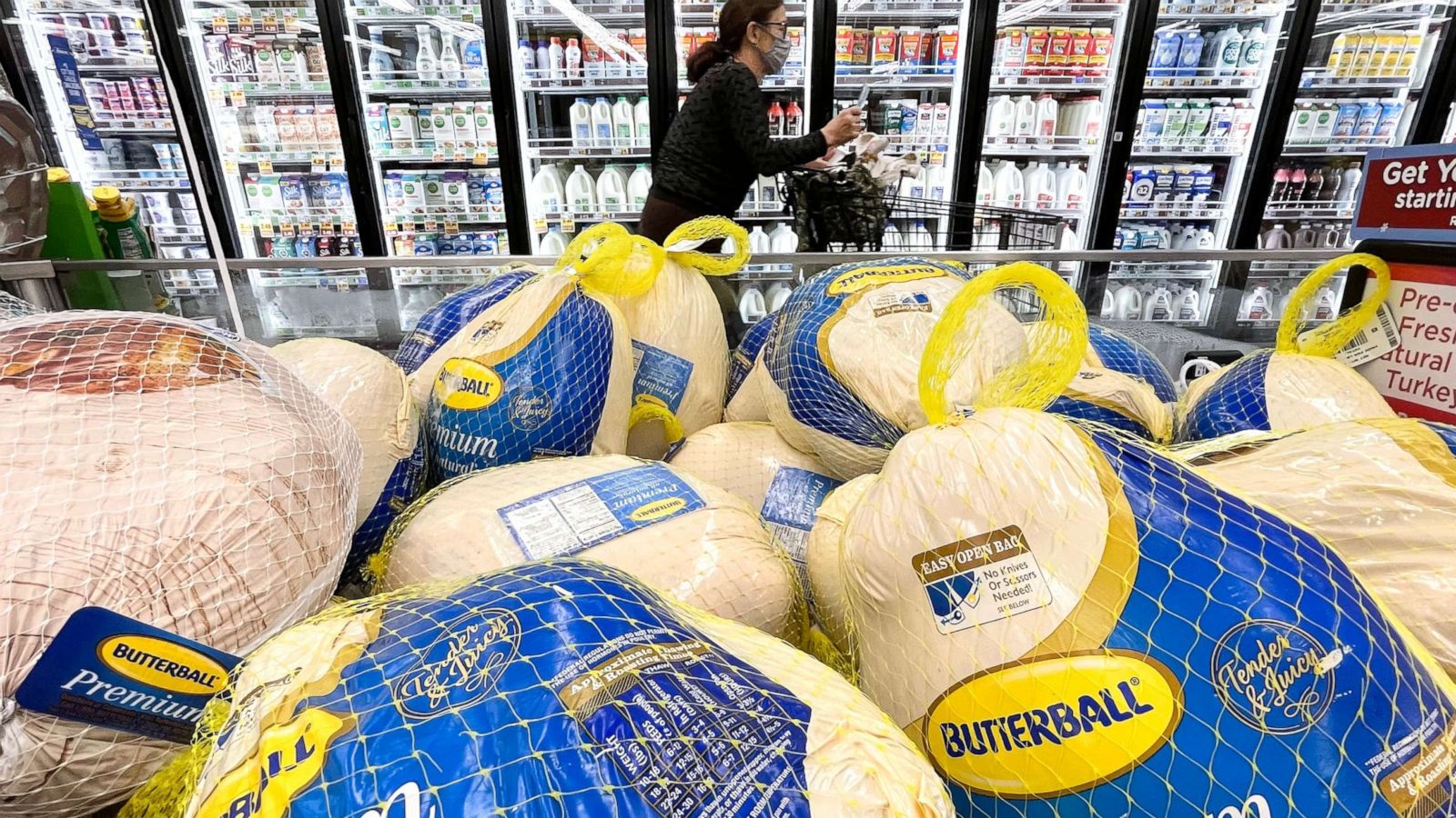 PHOTO: A shopper walks past turkeys displayed for sale in a grocery store ahead of the Thanksgiving holiday on Nov. 11, 2021, in Los Angeles.