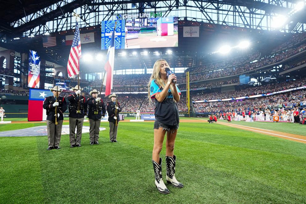 PHOTO: Ingrid Andress sings the national anthem prior to the 2024 T-Mobile Home Run Derby at Globe Life Field, on July 15, 2024, in Arlington, Texas. 