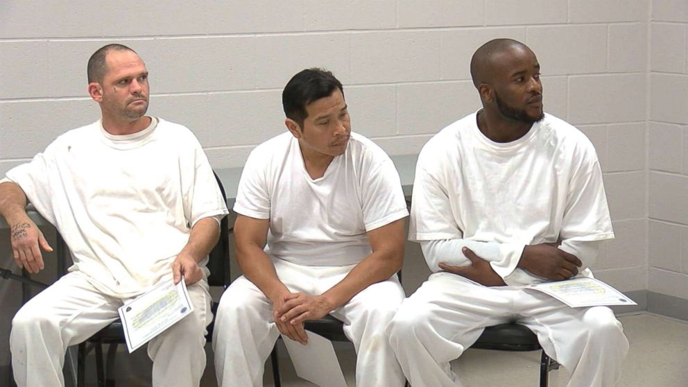 PHOTO:Inmates who rushed to aid the North Carolina officer overseeing them pick up trash when he collapsed on a road are awarded certificates of commendation.
