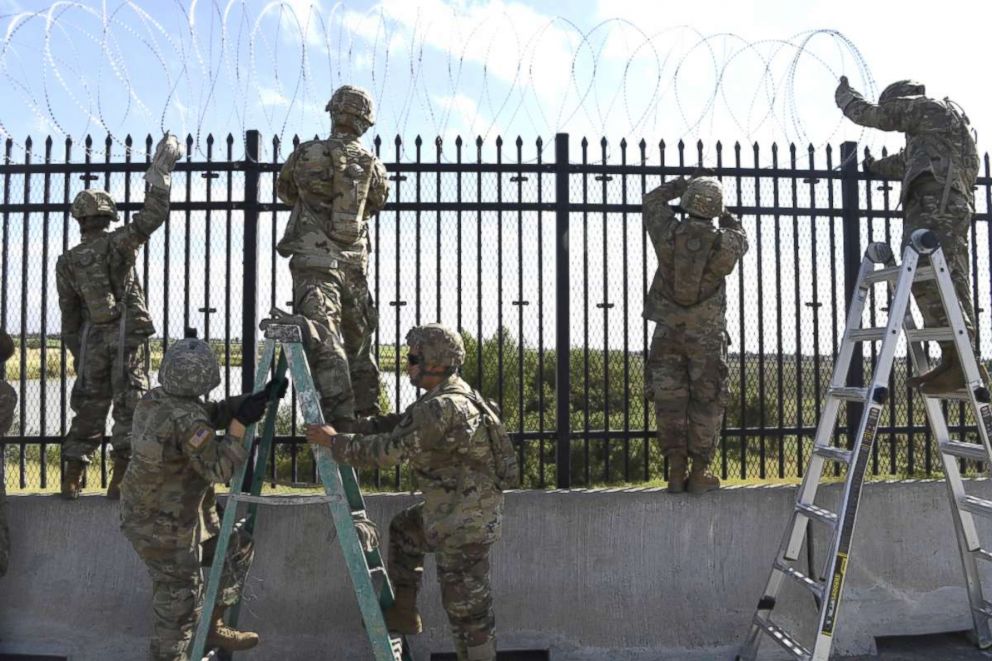 PHOTO: Soldiers from various Engineering Units install concertina wire Nov. 5, 2018, on the Anzalduas International Bridge, Texas.