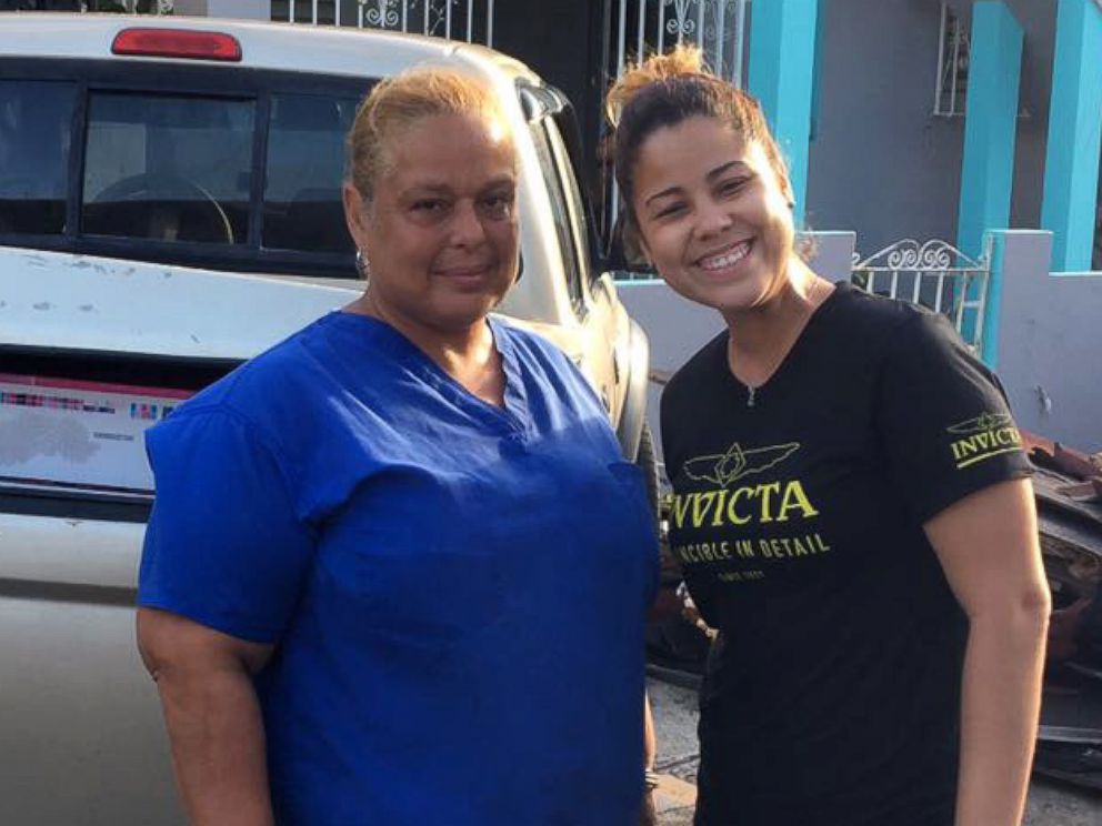 PHOTO: An Invicta Watch Group worker helps deliver aid that was sent from the company's CEO to Maria Ortiz, left, a caregiver at a nursing home in Puerto Rico. 