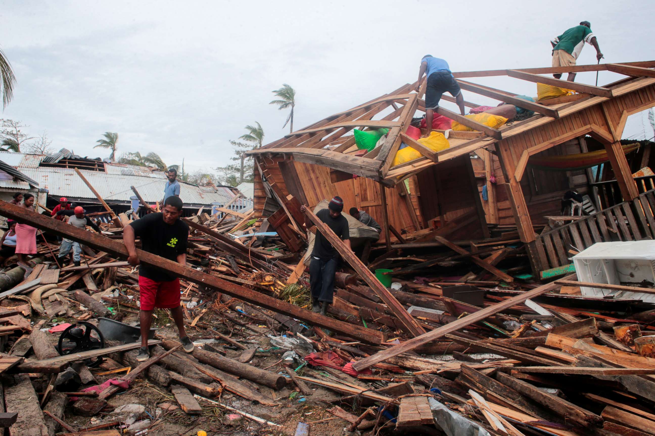 PHOTO: Residents remove debris from their houses destroyed by the passing of Hurricane Iota, in Puerto Cabezas, Nicaragua, Nov. 18, 2020.